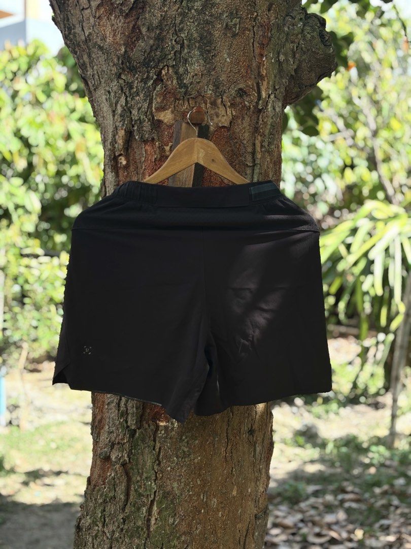 Lululemon Black Athletic Shorts (Category: Shorts) located in San Jacinto. Submitted by ticao_thrift (Listing ID 1467927870, Image 2). Description: - Brand: Lululemon - Color: Classic Black - Condition: Clean, no tears or stains - Features: Lightweight, moisture-wicking fabric with breathable side panels - Waistband: Elastic with adjustable branded drawstring - Extras: Reflective logo near the left hem for visibility - Ideal for: Running, gym wor