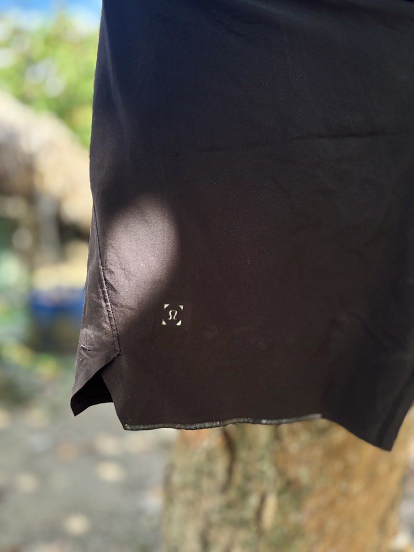 Lululemon Black Athletic Shorts (Category: Shorts) located in San Jacinto. Submitted by ticao_thrift (Listing ID 1467927870, Image 3). Description: - Brand: Lululemon - Color: Classic Black - Condition: Clean, no tears or stains - Features: Lightweight, moisture-wicking fabric with breathable side panels - Waistband: Elastic with adjustable branded drawstring - Extras: Reflective logo near the left hem for visibility - Ideal for: Running, gym wor