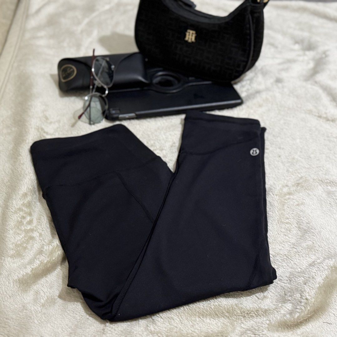 Lululemon Black Leggings Size 8 (Category: Activewear) located in Caloocan City. Submitted by bellita_05 (Listing ID 1468002095, Image 2). Description: - Brand: Lululemon - Color: Black - Size: 8 - Waistband: High-rise for extra support and comfort - Design: Classic style with signature logo near the hem - Material: Premium, comfortable stretch fabric - Condition: Clean, well-maintained, and gently used - Versatility: Ideal for yoga, workouts, or