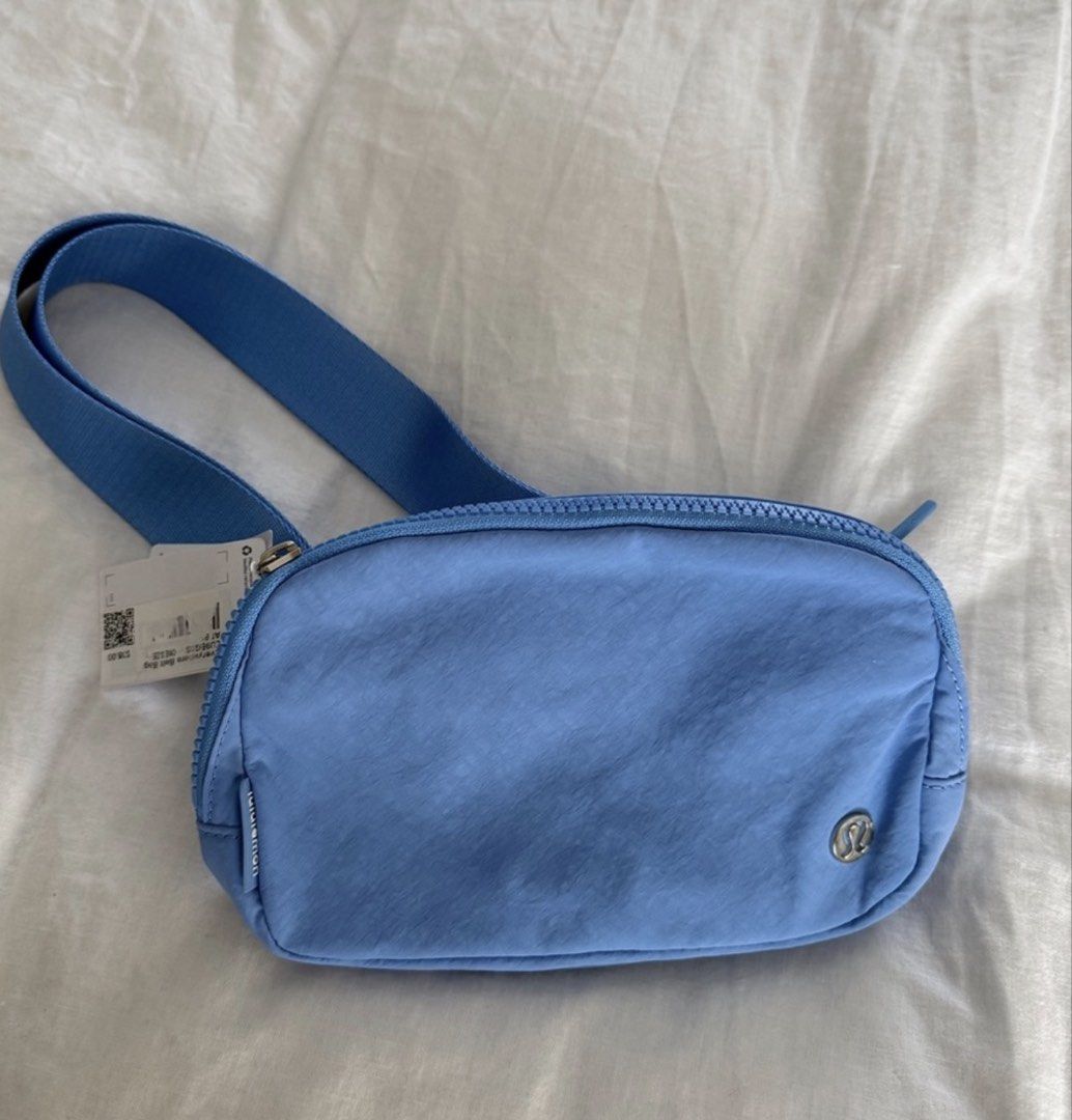 Lululemon Everywhere Belt Bag Blue (Category: Belt bags, Clutches and Pouches) located in Tabuk. Submitted by farawayluxe (Listing ID 1468005711, Image 2). Description: - Brand new with tags (BNWT), never worn - Color: Vibrant Blue - Adjustable strap for a comfortable fit - Secure zip main compartment and back zip pocket - Interior mesh slip pockets for easy organization - Perfect everyday size for phone, keys, and cards - Solid construction with