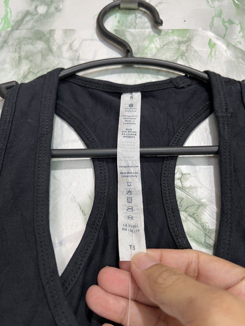 LULULEMON racerback (Category: Activewear) located in Bulacan. Submitted by letsfindukaywithme (Listing ID 1468044727, Image 3). Description: Lululemon racerback top Brand new w/ hang tag Size 6 13x27" Color: Black Cotton strechable No issue +sf payment first Ship via J&T.