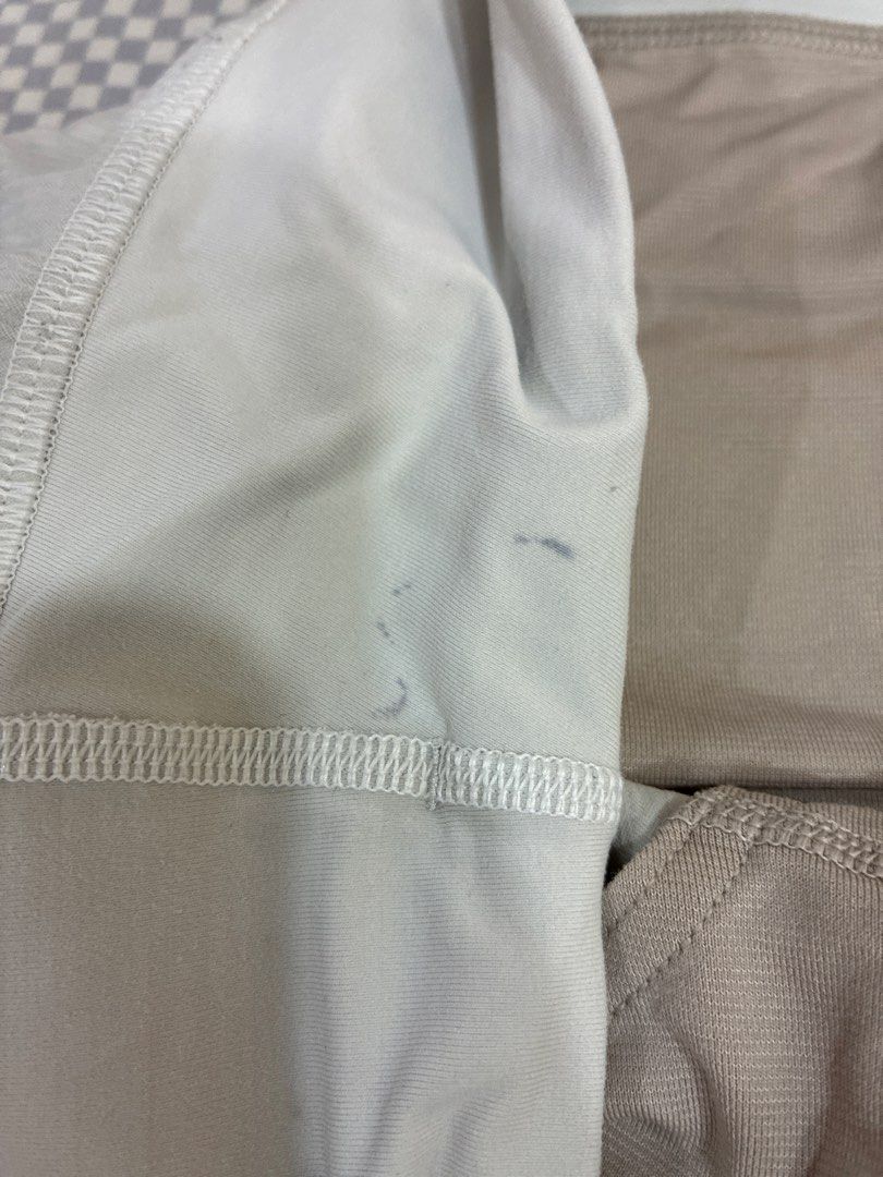 Lululemon Speed Up Shorts White (Category: Shorts) located in Manila. Submitted by shopmyclothesguys (Listing ID 1467922899, Image 2). Description: - Brand: Lululemon - Color: White - Style: Lightweight running shorts with inner lining - Features: High-rise waistband, secure back zip pocket, reflective logo on back hem - Condition: Good, but has small ink stains near the front seam (clearly shown in the 2nd photo) - Perfect for your daily runs an