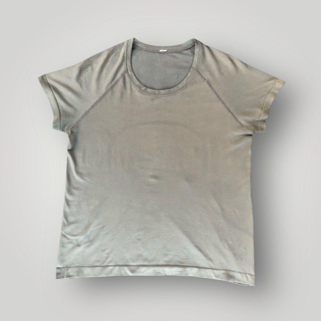 Lululemon Swiftly Tech Short Sleeve Crew (Category: Shirts) located in Paranaque City. Submitted by lesstash001 (Listing ID 1467978135, Image 1). Description: - Brand: Lululemon - Color: Greyish green - Design: Seamless construction with targeted mesh ventilation at the chest and upper back - Features: Classic crew neckline, short sleeves, and reflective logo on the upper back - Material: Sweat-wicking performance fabric - Condition: Excellent / 