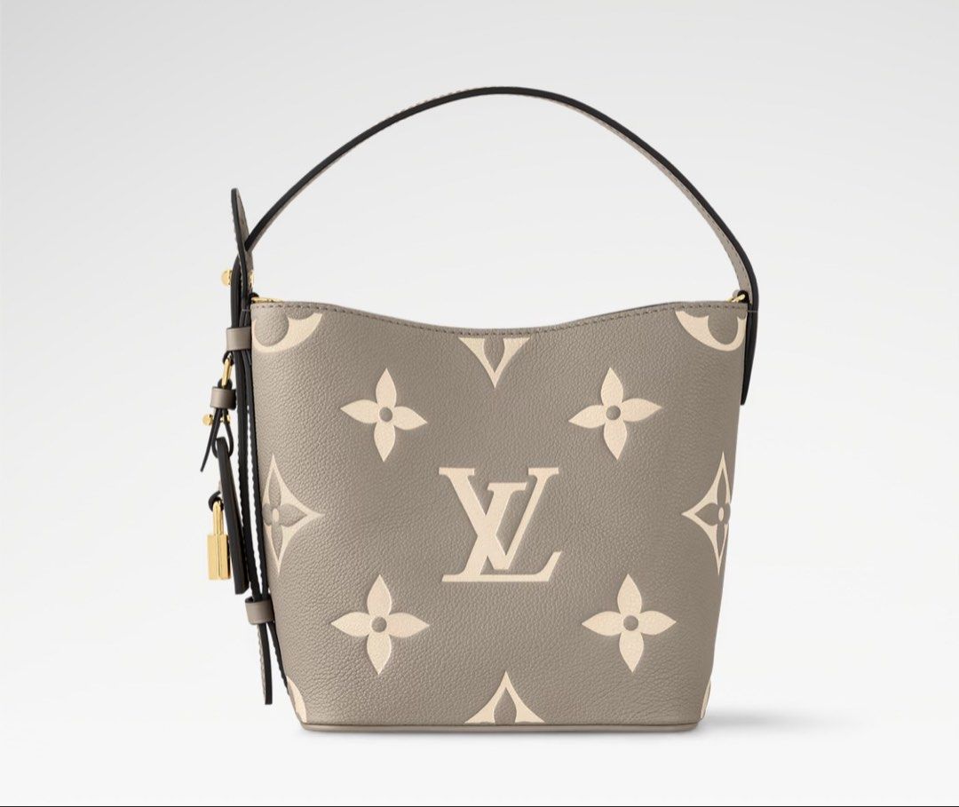 LV Nano Bucket Bag Monogram Empreinte (Category: Clutches) located in San Mateo. Submitted by trendsph_956 (Listing ID 1467840798, Image 1). Description: - Model: Nano Bucket Bag - Material: Monogram Empreinte leather in grey with cream embossed pattern - Hardware: Gold-tone throughout - Closure: Secure magnetic snap - Features: Structured shape, top handle, and cute padlock charm detail - Inclusion: Matching removable zipped pouch inside - Condi