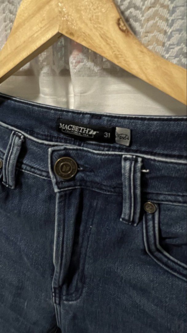 Macbeth California Dark Blue Denim Jeans Size 31 (Category: Jeans) located in Pasig City. Submitted by morilove (Listing ID 1467844532, Image 2). Description: - Brand: Macbeth California - Style: Denim jeans in dark blue wash - Size: 31 (Tag on waistband, approx. 15 inches across waist laid flat) - Closure: Button fly with branded hardware - Details: Custom graphic patch on back pocket, contrast stitching, and front coin pocket - Condition: Excel