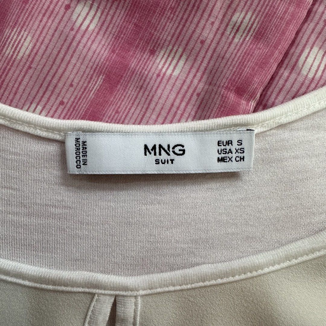 Mango - White Sleeveless Blouse (Category: Sleeveless) located in Muntinlupa City. Submitted by pickjes (Listing ID 1468022553, Image 3). Description: Brand: Mango Suit Size: Small Color: White Details: Semi-sheer, very versatile piece Measurements: • Width - 16.5” • Length - 24” Condition: Used max twice. No flaws. Wash tag detached. RFS: Decluttering White sleeveless tank top from Mango featuring a round scoop neckline and a subtle front keyhol