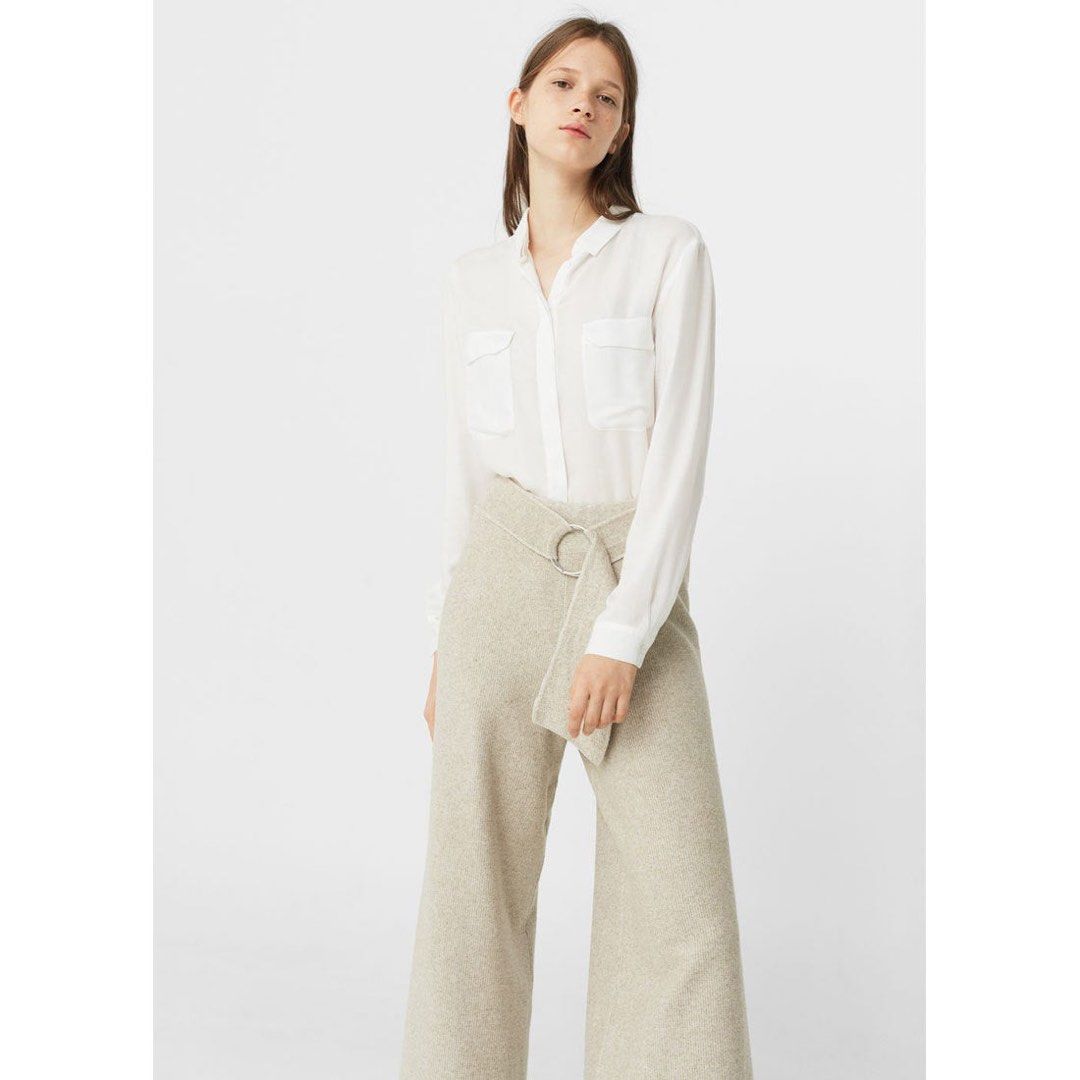 Mango Basics White Button-Down Shirt (Category: Shirts) located in Binan City. Submitted by hannahbanana928 (Listing ID 1467993851, Image 1). Description: - Brand: Mango Basics - Color: White - Size: EUR L, USA 8, MEX G - Style: Classic collar, long sleeves, dual front chest pockets - Fabric: Light, slightly sheer - Origin: Made in Bangladesh - Condition: Good, with a small faint mark near the right pocket area (shown in photos) - Versatile class