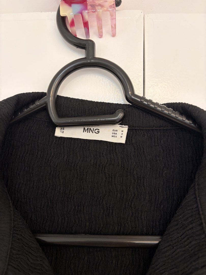 Mango Black Textured Button Down Shirt (Category: Blouses) located in Quezon City. Submitted by prelovedbynxkole (Listing ID 1467884753, Image 2). Description: - Brand: Mango - Color: Classic Black - Size: EUR M / USA 6 / MEX M - Material: Textured crinkle fabric - Fit: Standard fit - Details: Collared neck, long sleeves, button cuffs, and front button-down closure - Style: Versatile basic, easy to dress up for the office or style casually for ev