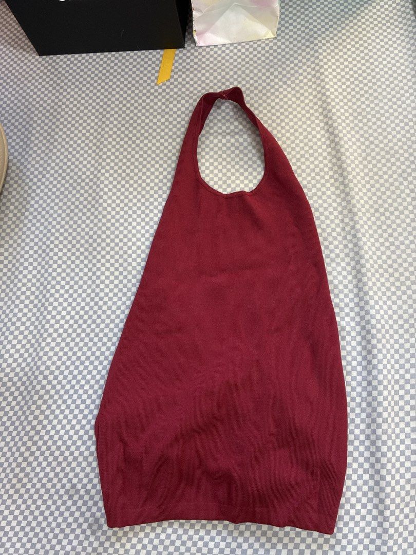Mango Red Halter Neck Crop Top (Category: Sleeveless) located in Manila. Submitted by shopmyclothesguys (Listing ID 1467917439, Image 1). Description: - Color: Maroon - Material: Stretchy ribbed knit fabric - Design: Halter top with high front neckline and open back - Detail: Chic circular O-ring at the lower back - Fit: Sleeveless, comfortable, and figure-flattering - Styling: Perfect to pair with high-waisted jeans or skirts for night outs.