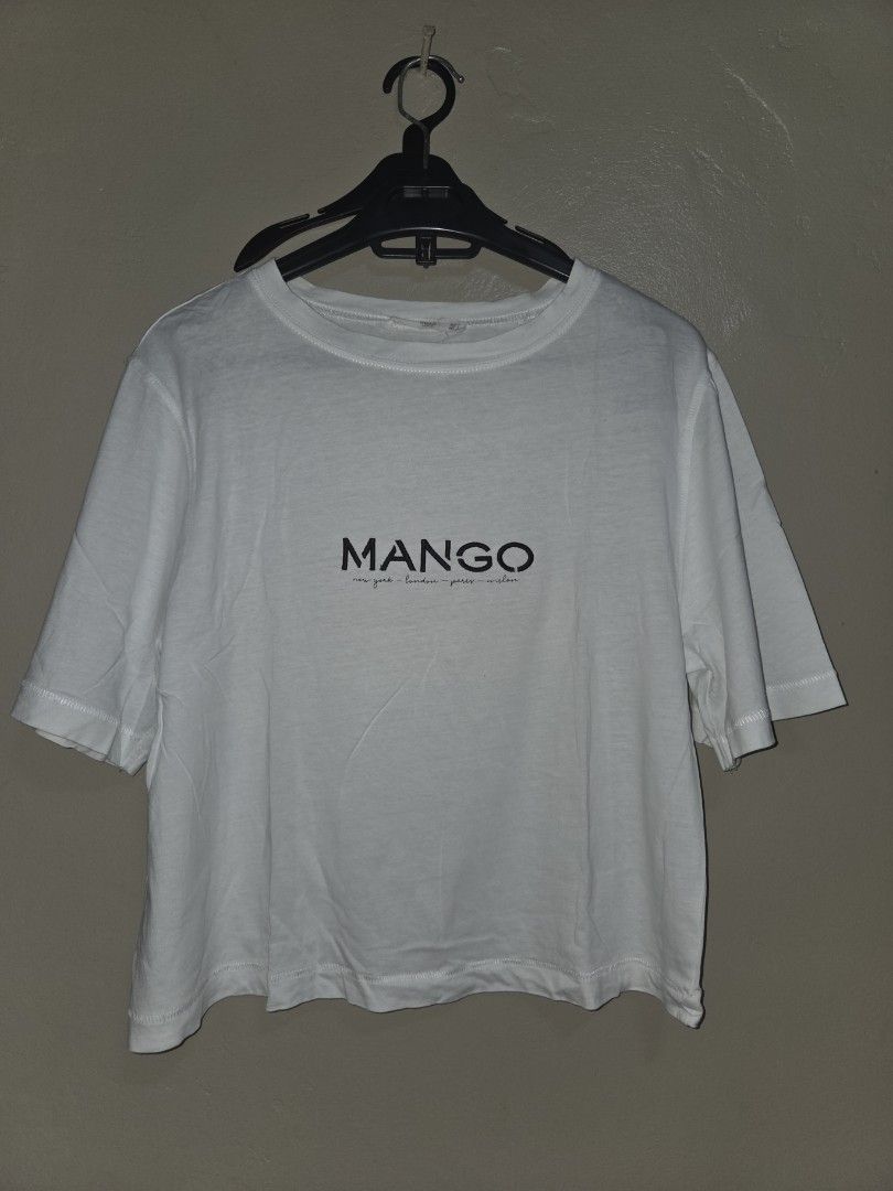 MANGO White Embroidered T-shirt (Category: Shirts) located in Quezon City. Submitted by klarebear15 (Listing ID 1468029000, Image 1). Description: - Brand: Mango - Color: White with black embroidered typography - Material: Soft, comfortable cotton - Design: Classic crew neck, short sleeves, plain solid back - Style: Casual everyday top, easy to pair with jeans or shorts.