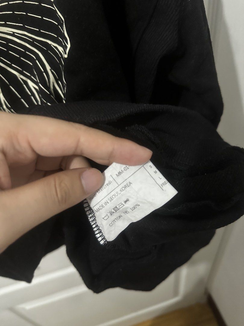 Mardi Mercredi Black Sweatshirt (Category: Coats, Jackets and Outerwear) located in Manila. Submitted by driftthrift (Listing ID 1467894625, Image 2). Description: - Brand: Mardi Mercredi - Color: Black with iconic floral graphic and white lettering - Material: 100% Cotton - Origin: Made in Seoul, South Korea - Fit: Standard fit with comfortable crewneck, ribbed cuffs, and hem - Condition: Brand new / Excellent quality.
