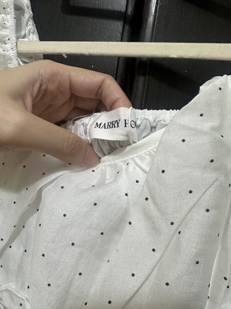 Marry House White Polka Dot Ruffle Top (Category: Blouses) located in Villasis. Submitted by juliaxgamboa (Listing ID 1467945853, Image 3). Description: - Bangkok top - Condition: Brand New with Tag (BNWT), never worn - Design: White mini dress with all-over black polka dots and tiered ruffles - Details: Square neckline, chic puff sleeves - Fit: Comfortable smocked bodice and waistline - Fabric: Lightweight and breathable - Origin: Made in Thaila