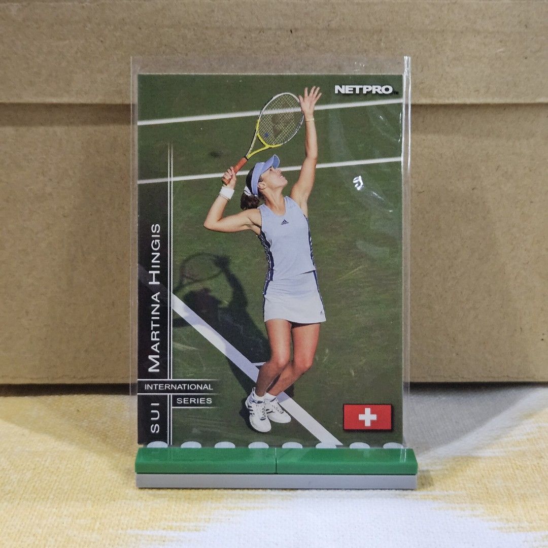 Martina Hingis (Category: Raw Singles) located in Las Pinas. Submitted by kapkards (Listing ID 1467879199, Image 1). Description: - Player: Martina Hingis (Switzerland) - Brand/Series: Netpro International Series Tennis Trading Card - Condition: Clean surface and sharp corners - Protection: Stored inside a clear protective sleeve - Inclusions: Comes with a green plastic display stand attached - Ideal for tennis memorabilia collectors and fans.