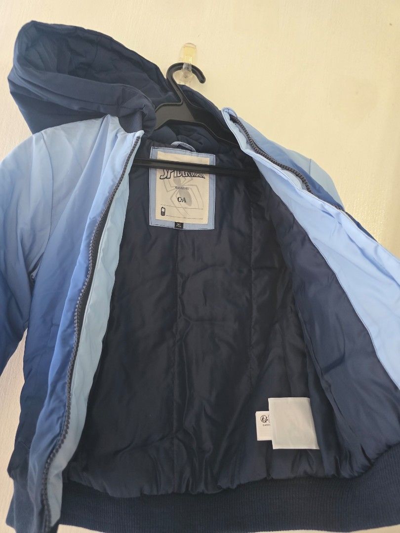 Marvel Spiderman Hooded Thick Jacket 7Y (Category: Babies & Kids Fashion) located in Las Pinas. Submitted by garieh (Listing ID 1467910163, Image 3). Description: Spider-Man jacket from C&A. Blue ombre design with zipper front and attached hood. Small Spidey patch on the chest and large "GO SPIDEY!" graphic printed on the back. Two front pockets. Inside label shows size 122cm, fits around 7 years old. Dark blue lining inside. Great outerwear piec