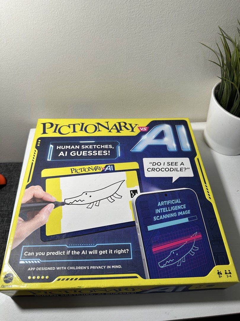 Mattel Pictionary vs AI Game (Category: Board Games & Puzzles) located in Cabanatuan. Submitted by s.kit.27 (Listing ID 1468019794, Image 1). Description: - Game: Pictionary vs AI by Mattel - Players & Age: 2 to 4 players, ages 8 and up - How to play: Humans sketch drawings and AI tries to guess them - Inclusions: Phone holder, erasable board holder, gameboard, 112 clue cards, 4 movers, 4 wet erase markers, 4 erasable boards, and 8 tokens - Condi