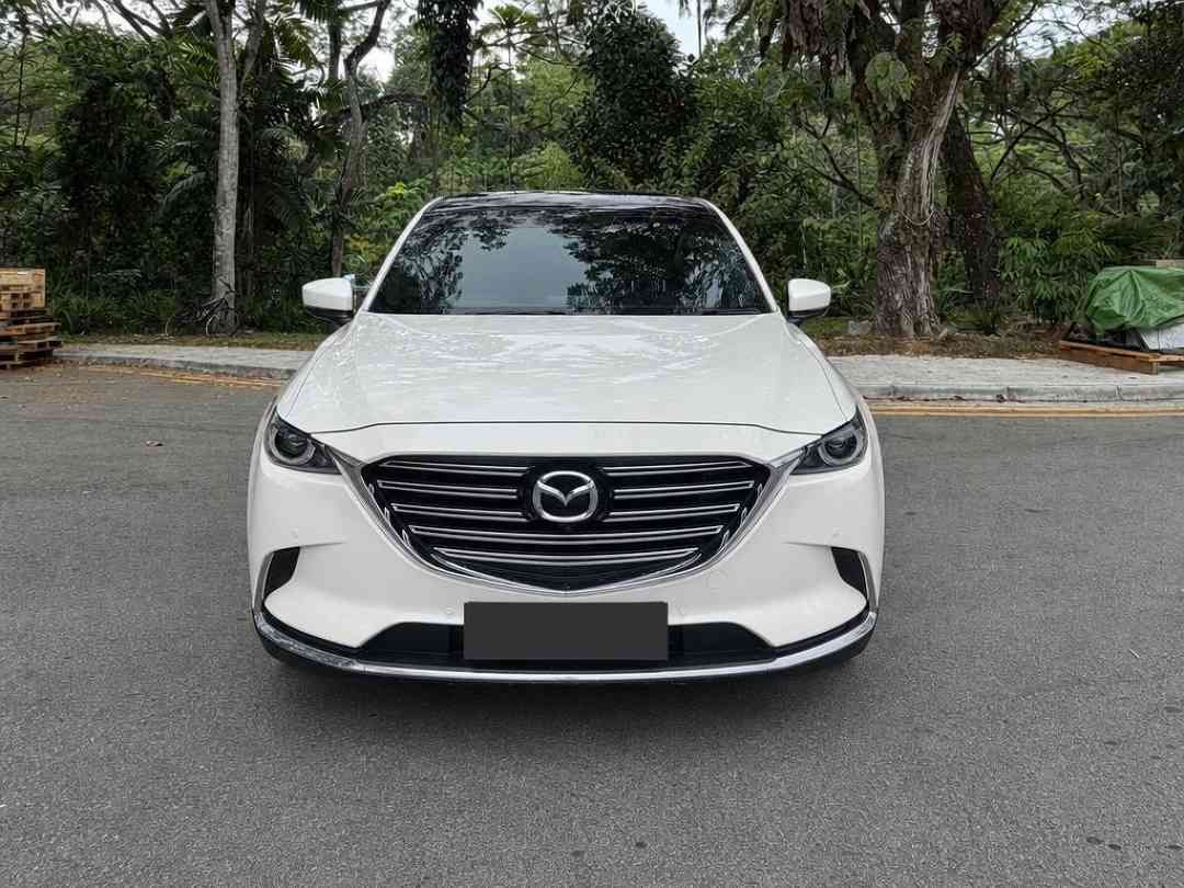 Mazda CX-9 2.5 2WD Turbo (A) (Category: Used Cars) located in Singapore. Submitted by carousell_certified_partners (Listing ID 1467628388, Image 1). Description: Popular family SUV with performance and sporty look and white paintwork. Loan with high trade in available. Price negotiable. Call us now or visit our showroom today. Features: 2.5L turbocharged engine with 6-speed auto, powerful yet smooth drive, 7-seater SUV, keyless entry/start, cruis