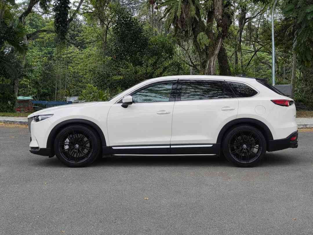 Mazda CX-9 2.5 2WD Turbo (A) (Category: Used Cars) located in Singapore. Submitted by carousell_certified_partners (Listing ID 1467628388, Image 3). Description: Popular family SUV with performance and sporty look and white paintwork. Loan with high trade in available. Price negotiable. Call us now or visit our showroom today. Features: 2.5L turbocharged engine with 6-speed auto, powerful yet smooth drive, 7-seater SUV, keyless entry/start, cruis