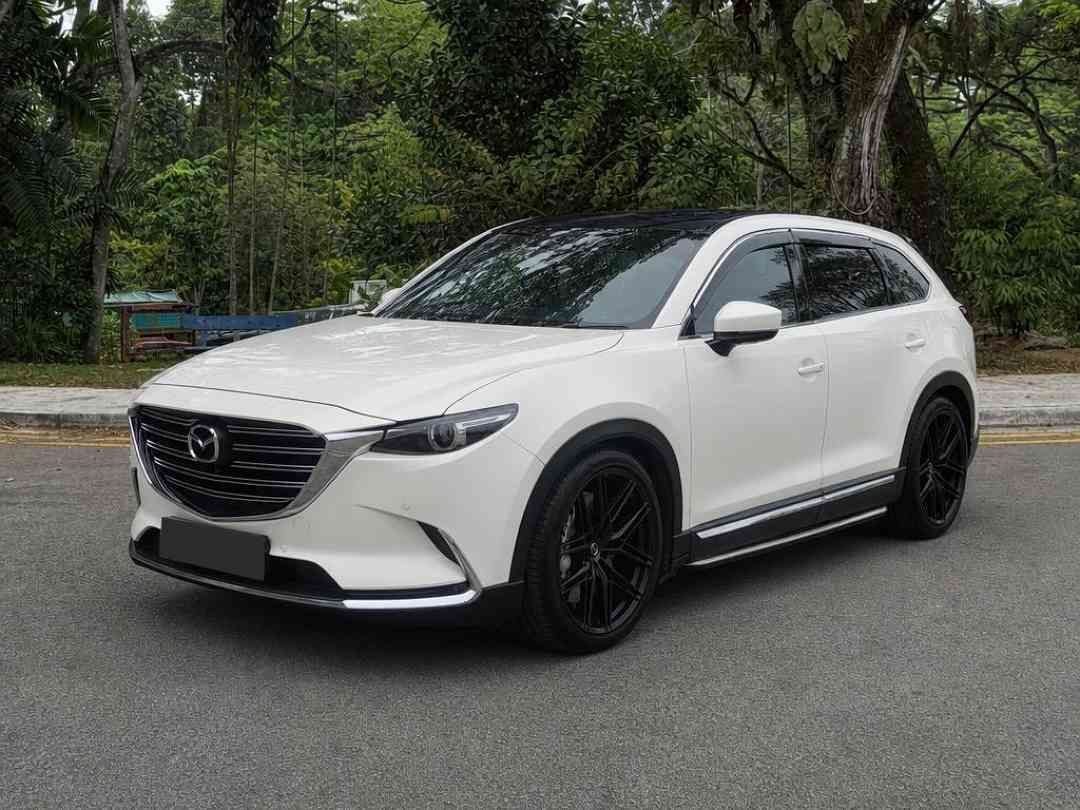 Mazda CX-9 2.5 2WD Turbo (A) (Category: Used Cars) located in Singapore. Submitted by carousell_certified_partners (Listing ID 1467628388, Image 2). Description: Popular family SUV with performance and sporty look and white paintwork. Loan with high trade in available. Price negotiable. Call us now or visit our showroom today. Features: 2.5L turbocharged engine with 6-speed auto, powerful yet smooth drive, 7-seater SUV, keyless entry/start, cruis