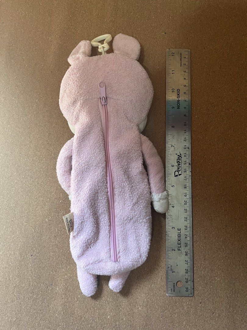 Metoo Pink Bunny Plush Pencil Case (Category: Plushies & Soft Toys) located in Baguio. Submitted by gaara1234 (Listing ID 1467857648, Image 2). Description: - Authentic Metoo brand pink bunny plush pencil case - Super soft material with adorable embroidered sleepy eyes and face - Features a cute polka dot bow tie and heart patch - Generous size: roughly 11 inches long total - Secure zipper along the back to store pens and school supplies - Conven