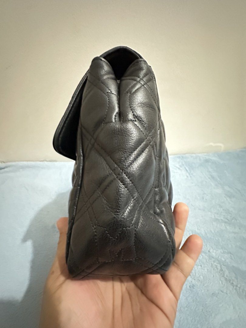 Metrocity Black Quilted Leather Chain Shoulder Bag (Category: Luxury Bags & Wallets) located in Calamba. Submitted by nympha0630 (Listing ID 1467860697, Image 3). Description: Metrocity black quilted leather shoulder bag. Gold chain strap and hardware. Turn-lock closure on the front flap. Structured rectangular shape with four protective metal feet on the bottom base. Quilted pattern includes embossed M monograms throughout the leather surface. C
