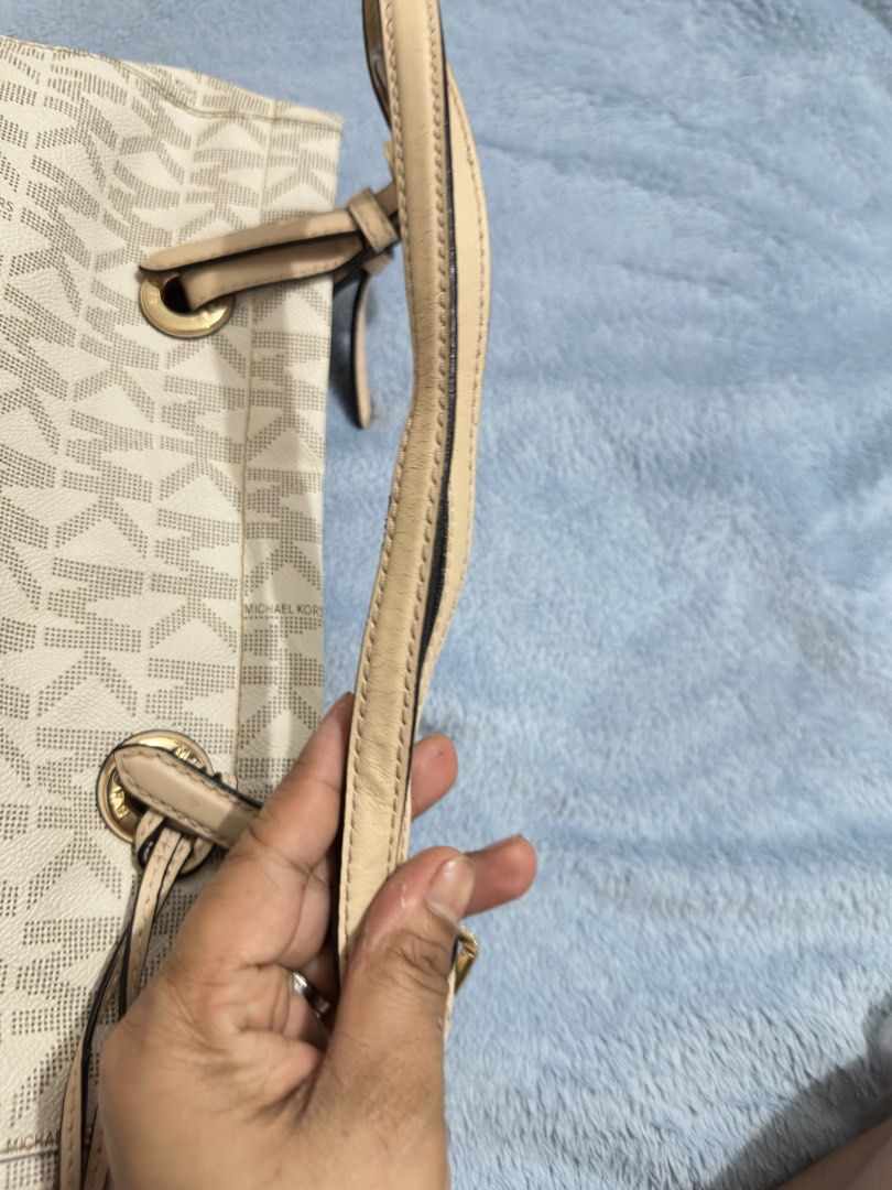 Michael Kors MK monogram canvas beige tote bag (Category: Luxury Bags & Wallets) located in Calamba. Submitted by nympha0630 (Listing ID 1467854260, Image 2). Description: - Brand: Michael Kors - Design: Classic beige & white MK monogram print with cream leather trim - Hardware: Premium gold-tone hardware - Straps: Dual shoulder straps with adjustable buckle details - Inclusion: Matching round MK logo charm - Interior: Spacious compartment, perfe