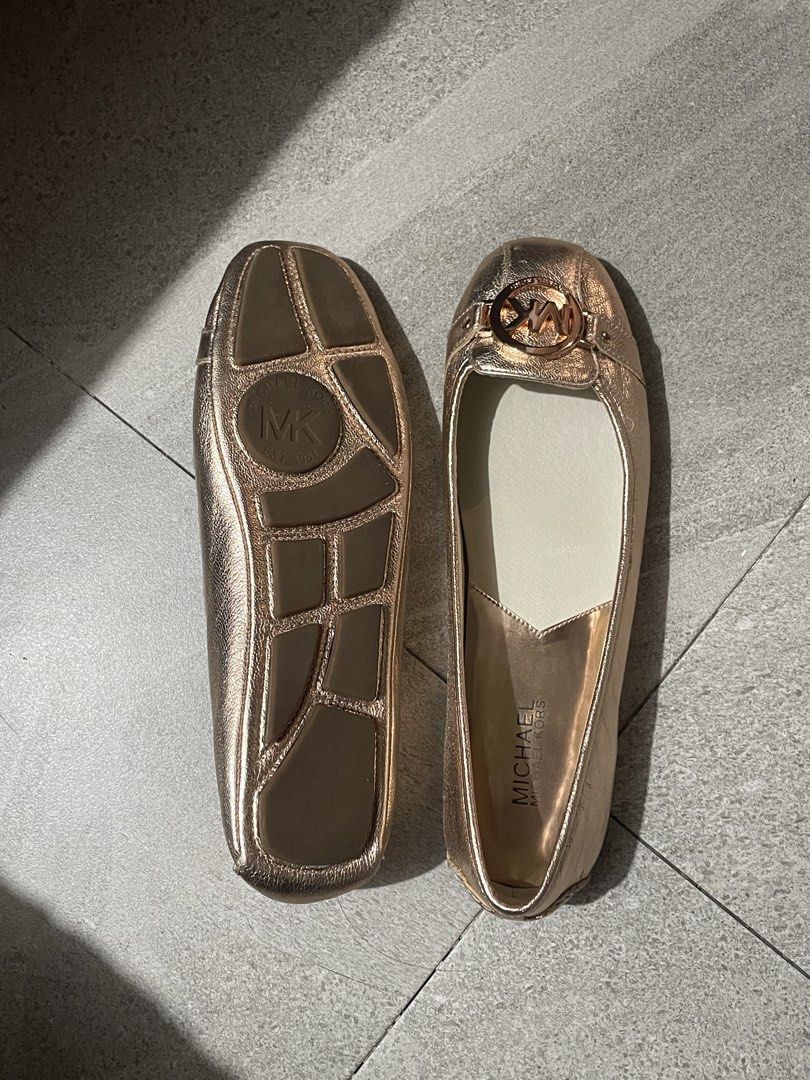 Michael Kors Rose Gold Metallic Flats (Category: Flats & Sandals) located in Quezon City. Submitted by cosmicbear-8455 (Listing ID 1467969293, Image 3). Description: DETAILS: * Brand: Michael Kors * Style: Fulton Flats * Color: Rose Gold * Material: Metallic Leather * Size: US 9.5M (great for wide feet) * Condition: Brand new, never worn * Includes original shoe box * Details: Round toe with signature MK logo hardware buckle, stamped branding on 
