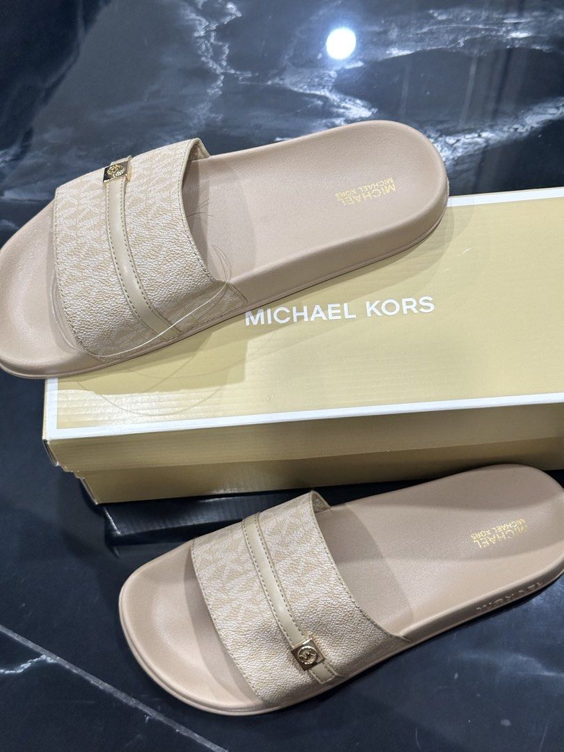 Michael Kors Slides (Category: Sneakers & Footwear) located in Pasay City. Submitted by crewonthego (Listing ID 1467988904, Image 2). Description: Selling my michael kors slides in beige/cream color BRAND NEW i bought in Los Angeles USA for only 2,800 pesos. Slightly nego.