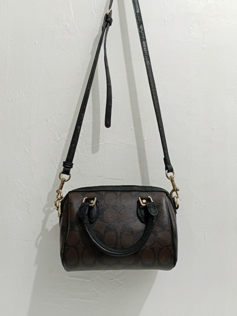 Original MINI ROWAN Coach bag (Category: Luxury Bags & Wallets) located in Manila. Submitted by eriiicaspage (Listing ID 1467944042, Image 2). Description: PreOwned Lightly Used WellUsed Authentic Mini Rowan Coach bag - Style: Mini Satchel - Material: Signature coated canvas with black leather trim - Hardware: Gold-tone - Closure: Zip-top - Strap: Dual top handles + adjustable/detachable crossbody strap - Ideal for daily essentials and errands Si