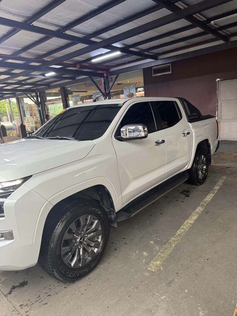 Mitsubishi Triton GLS Auto (Category: Used Cars) located in Manila. Submitted by jekpu (Listing ID 1467981424, Image 3). Description: 🚙 FOR SALE: 2024 Mitsubishi Triton GLS 💰 Asking Price: ₱1,300,000 ✨ LOW MILEAGE • ALL STOCK • LIKE BRAND NEW ✨ • 2024 Mitsubishi Triton GLS • Only 12,000 km • White Diamond • Automatic Transmission • Casa Maintained • Registration valid until 2027 • All Stock • With Cage Roller • No scratches / very clean exterio
