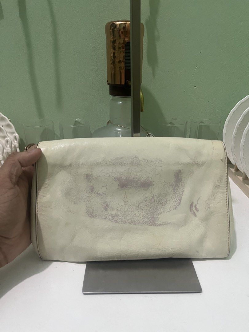 Miu Miu Calfskin Clutch (Category: Belt bags, Clutches and Pouches) located in Manila. Submitted by thriftniyuno (Listing ID 1467997321, Image 2). Description: Color transfer back part but still good condition .