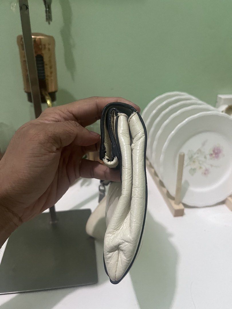 Miu Miu Calfskin Clutch (Category: Belt bags, Clutches and Pouches) located in Manila. Submitted by thriftniyuno (Listing ID 1467997321, Image 3). Description: Color transfer back part but still good condition .