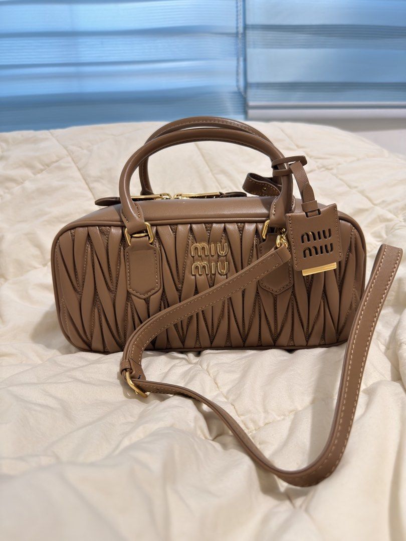 Miumiu Arcadie leather bag (Category: Announcements) located in Manila. Submitted by ninalumbang (Listing ID 1467943904, Image 3). Description: with box and dustbag 27cm measurement brown color no issue almostnew authentic or your moneyback no meet up shipping only. .