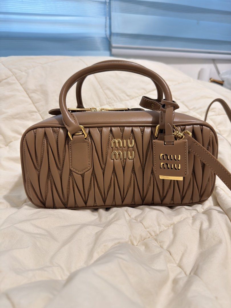 Miumiu Arcadie leather bag (Category: Announcements) located in Manila. Submitted by ninalumbang (Listing ID 1467943904, Image 1). Description: with box and dustbag 27cm measurement brown color no issue almostnew authentic or your moneyback no meet up shipping only. .