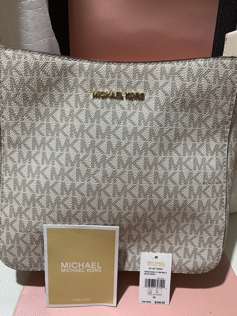 MK shoulder/sling bag (Category: Cross-body Bags) located in General Trias. Submitted by vpshoppe (Listing ID 1467989467, Image 2). Description: Brandnew MK Jet set travel sling/shoulder bag guitar strap white with price tag/care card medium for sure buyer only .