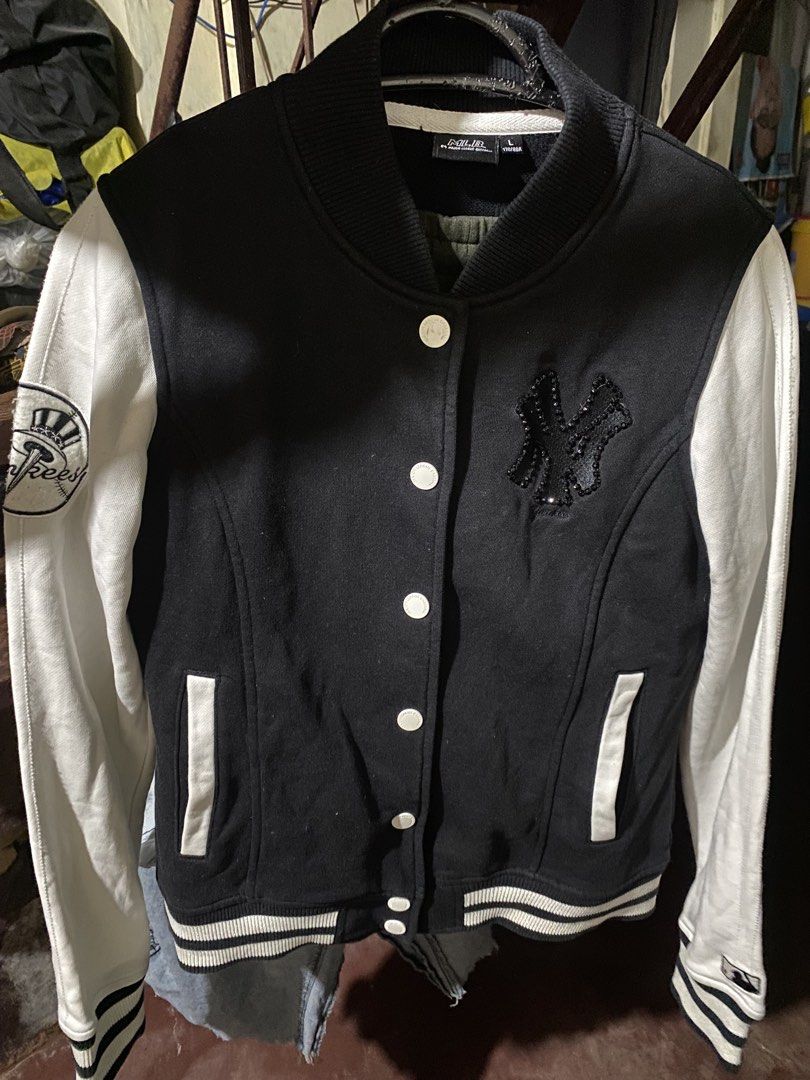MLB New York Yankees Varsity Jacket Black White (Category: Coats, Jackets and Outerwear) located in Manila. Submitted by applemint011 (Listing ID 1467875270, Image 2). Description: - Brand: MLB New York Yankees - Item: Varsity Jacket - Color: Black body with white sleeves - Size: L - Closure: Snap-button front - Details: Crystal-embellished NY logo on chest, baseball patch on right sleeve, and MLB batterman logo embroidery on left cuff - Features