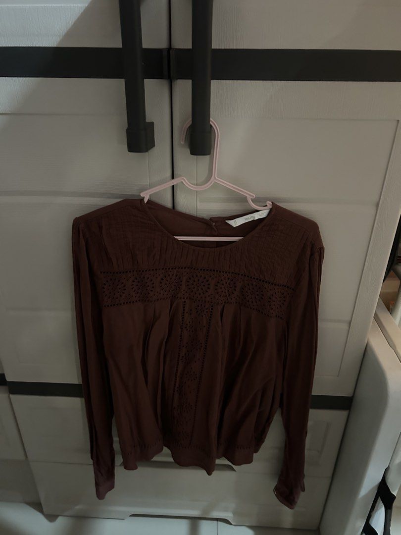 MANGO Brown Long Sleeve Blouse Size L (Category: Longsleeves) located in Makati City. Submitted by sophcrates (Listing ID 1467984445, Image 1). Description: - Brand: MANGO - Size: EUR L / USA 8 / MEX G - Color: Brown - Design: Round neckline with back button closure - Details: Beautiful cutout embroidery on the chest and front RFS decluttering PM for more info last price indicated .