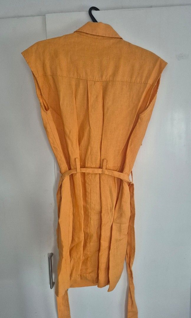 MNG Yellow Linen Button Shirt Size M (Category: Blouses) located in Taguig. Submitted by declutter_it420 (Listing ID 1467736136, Image 2). Description: - Brand: Mango - Size: Medium (M) - Color: Oranfe - Material: Lightweight linen, ideal for warm weather - Style: Classic collar with front button-down closure - Condition: Clean, excellent, and ready to wear -Versatility: Can be worn for the office or casual outings.