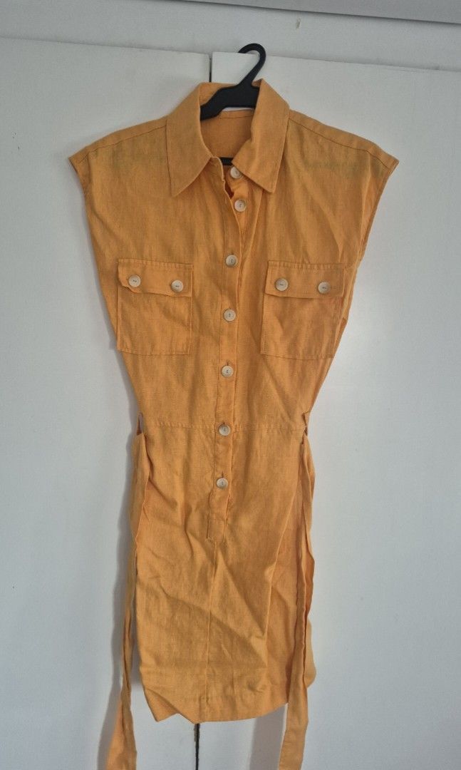 MNG Yellow Linen Button Shirt Size M (Category: Blouses) located in Taguig. Submitted by declutter_it420 (Listing ID 1467736136, Image 1). Description: - Brand: Mango - Size: Medium (M) - Color: Oranfe - Material: Lightweight linen, ideal for warm weather - Style: Classic collar with front button-down closure - Condition: Clean, excellent, and ready to wear -Versatility: Can be worn for the office or casual outings.