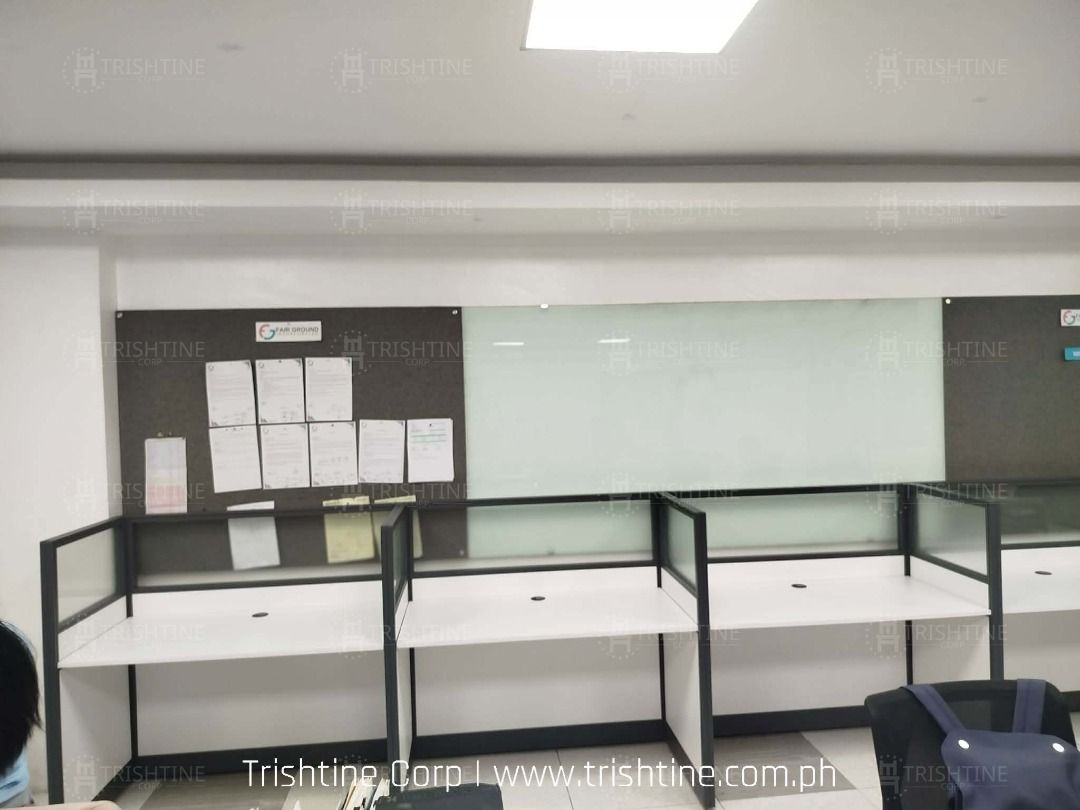 Modern Office Cubicle Workstation Desk Partition (Category: Office Furniture & Fixtures) located in Caloocan City. Submitted by jim.trishtineofficefurnitures (Listing ID 1467883861, Image 3). Description: - Cubicle workstations available for call centers, offices, and team spaces - Clean white desktop surface with built-in grommet holes for easy cable management - Frosted glass and solid panel dividers for privacy - Sturdy dark gray metal framing
