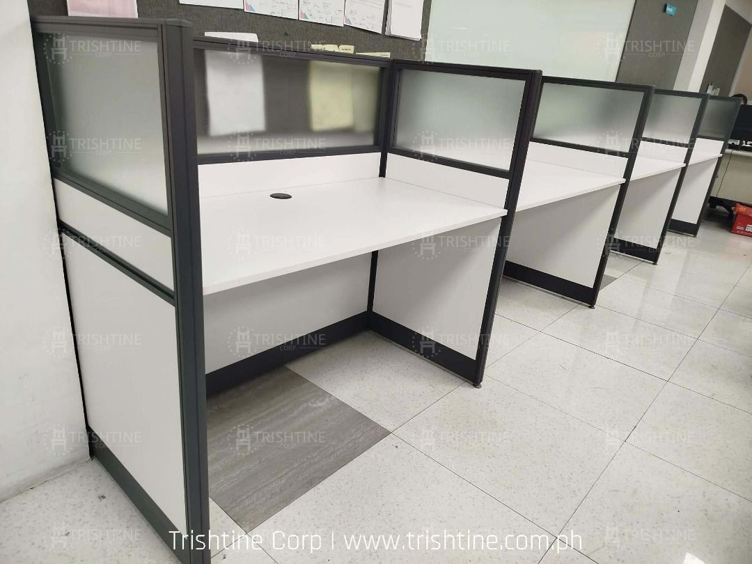 Modern Office Cubicle Workstation Desk Partition (Category: Office Furniture & Fixtures) located in Caloocan City. Submitted by jim.trishtineofficefurnitures (Listing ID 1467883861, Image 2). Description: - Cubicle workstations available for call centers, offices, and team spaces - Clean white desktop surface with built-in grommet holes for easy cable management - Frosted glass and solid panel dividers for privacy - Sturdy dark gray metal framing