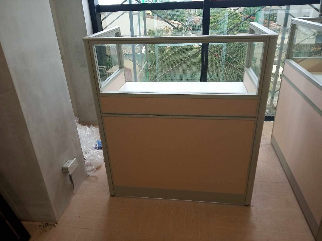 Modular Office Cubicle Desk with Glass Partition (Category: Office Furniture & Fixtures) located in Caloocan City. Submitted by jim.trishtineofficefurnitures (Listing ID 1467921875, Image 2). Description: - Office cubicle desk set featuring stylish light pink fabric panels and frosted glass top sections - Spacious white work surface equipped with a built-in cable management grommet - Durable and sturdy metal frame construction for long-lasting us