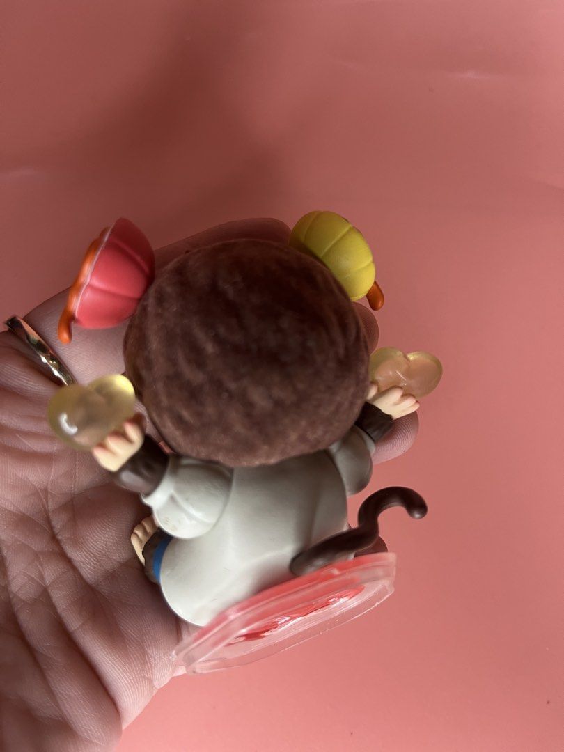Monchhichi Art Toy Figurine Bubble Gum (Category: Designer & Blind Box Toys) located in Caloocan City. Submitted by snapshop_ph (Listing ID 1468055596, Image 3). Description: - Authentic Monchhichi collectible figure in excellent, clean condition - Features a charming monkey blowing a bubble gum bubble with colorful hair accessories - Wears a cute white and blue outfit with yellow buttons, holding yellow hearts in both hands - Surface is free fro