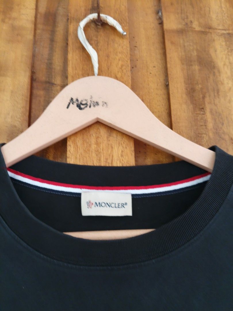 Moncler Pocket T-Shirt Black (Category: Tshirts & Polo Shirts ) located in Cateel. Submitted by melvin_122 (Listing ID 1467880434, Image 2). Description: - Brand: Moncler - Color: Black - Material: Soft cotton jersey for everyday comfort - Design: Short sleeves with signature Tricolor trim on the chest pocket and inner collar - Details: Moncler logo patch on left sleeve and embroidered emblem on the pocket - Authenticity: Includes internal label 