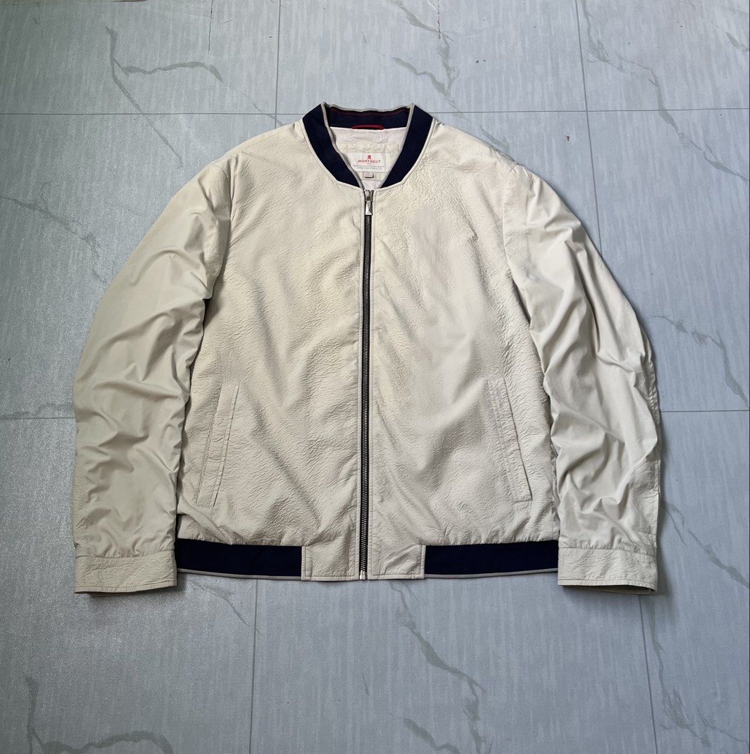Montagut Paris Bomber Wind Jacket (Authentic) (Category: Coats, Jackets and Outerwear) located in Cavite. Submitted by newclassicwear (Listing ID 1467923206, Image 1). Description: Size 52 On Tag (24width 28length) Excellent Condition None Any Issue 9.8 Honest Color Rate Can Do Meet Up Around Sm Tanza Cavite Tanza📍 Authentic Montagut Paris cream bomber wind jacket in good pre-loved condition. Features a textured body, smooth sleeves, navy ribbed
