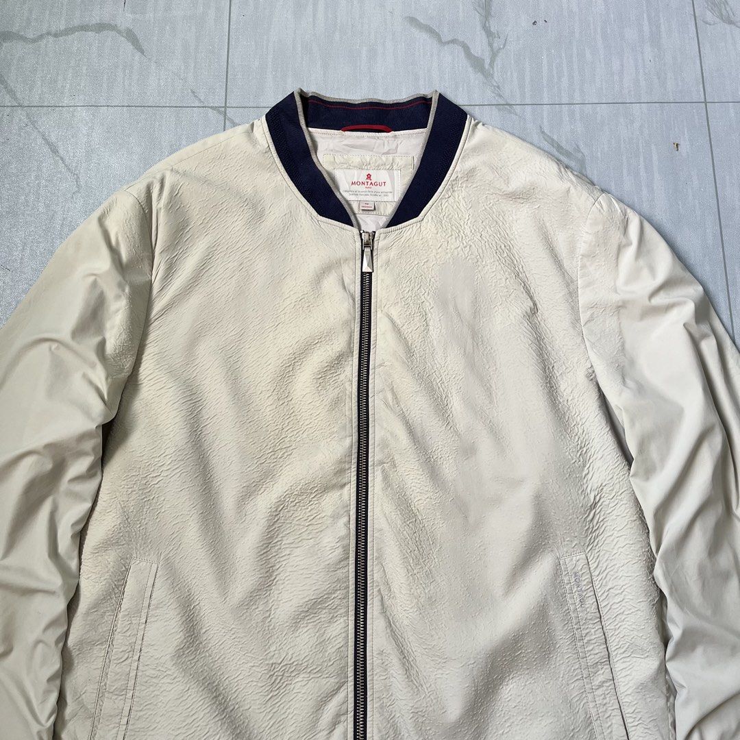 Montagut Paris Bomber Wind Jacket (Authentic) (Category: Coats, Jackets and Outerwear) located in Cavite. Submitted by newclassicwear (Listing ID 1467923206, Image 2). Description: Size 52 On Tag (24width 28length) Excellent Condition None Any Issue 9.8 Honest Color Rate Can Do Meet Up Around Sm Tanza Cavite Tanza📍 Authentic Montagut Paris cream bomber wind jacket in good pre-loved condition. Features a textured body, smooth sleeves, navy ribbed