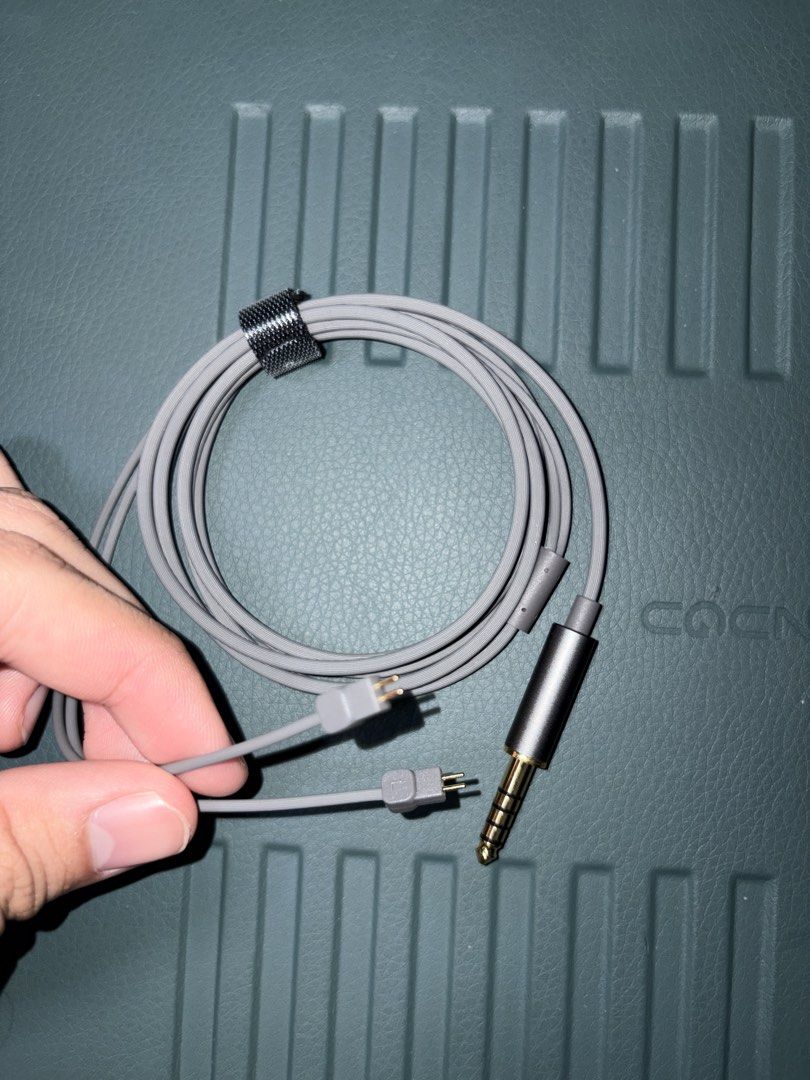 Moondrop 4.4mm Balanced Headphone Cable (Category: Headphones & Headsets) located in Caloocan City. Submitted by cringeslophaven (Listing ID 1467998772, Image 2). Description: - Genuine Moondrop 4.4mm balanced headphone cable - Terminations: 4.4mm balanced jack to dual proprietary 2-pin connectors - Compatibility: Works with any open-back models - Design: Soft grey flat wire jacket with a built-in cable slider - Extras: Includes a handy Velcro ca