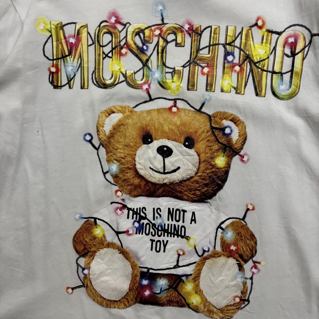 MOSCHINO WHITE SHIRT (Category: Tshirts & Polo Shirts ) located in Taytay. Submitted by dwinsapparel (Listing ID 1467939911, Image 2). Description: MOSCHINO WHITE SHIRT W-21 L-24.5 EXCELLENT CONDITION NEED WASH COMPLETE TAGS.