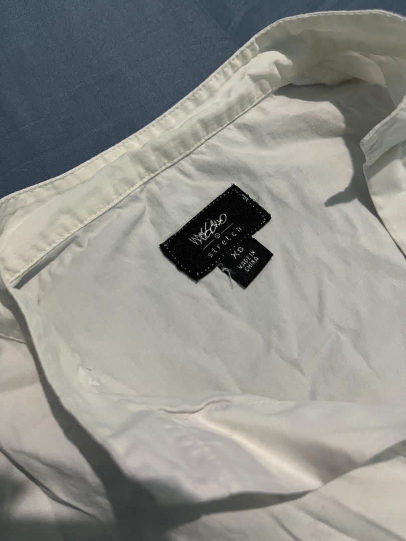 Mossimo Stretch White Short-Sleeve Button-Up Blouse - Size XS (Category: Blouses) located in Calapan. Submitted by shop_storeal (Listing ID 1467839838, Image 2). Description: Brand: Mossimo (Stretch line) Size: Extra Small (XS) Condition: Gently Used / Good Condition Flaws: Fabric is wrinkled from storage; no visible stains, tears, or missing buttons. MOP: Gcash, GoTyme MOD: J&T 🚚 PROMO: Buy 2 or more items from my listing at regular price & get