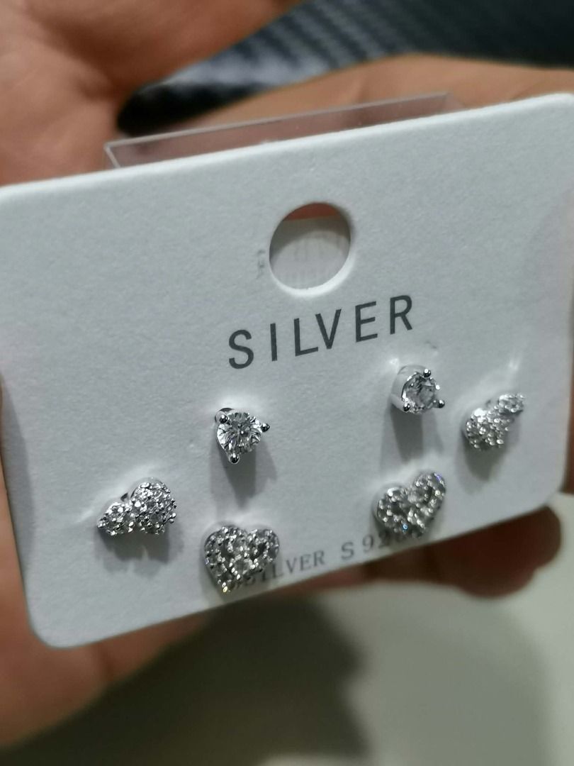 MPCZE14 MULTI-PAIR CUBIC ZIRCONIA Stud Sterling SILVER Earrings Set (Category: Earrings) located in Cavite. Submitted by falconsclawset (Listing ID 1467917527, Image 3). Description: - Set of 3 pairs of stud earrings featuring solitaire, heart, and gourd designs - Crafted with shimmering pave-set cubic zirconia details - Silver S925 stamped on the original display card - 100% brand new and unworn condition - Perfect for everyday wear or gifting.