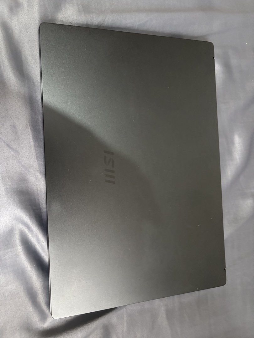 MSI Modern 14 14-inch Laptop Intel Core i3 (Category: Laptops & Notebooks) located in Imus. Submitted by migueldcs (Listing ID 1467866029, Image 1). Description: - Brand/Model: MSI Modern 14 (Model MS-14D3) - Color: Sleek Dark Grey - Processor: Intel Core i3 - Manufacture Date: February 2022 - Keyboard: Standard QWERTY layout with a spacious trackpad - Camera: Built-in top bezel webcam - Cooling & Support: Multiple cooling vents and intact rubber
